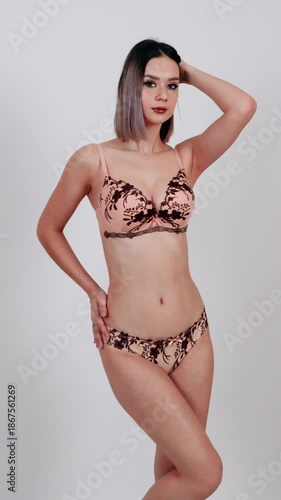 Beautiful woman in animal print bra and panties.