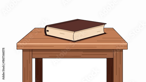 A closed, dark brown hardcover book rests on a wooden table