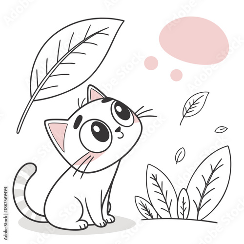 Playful kitten with leaves