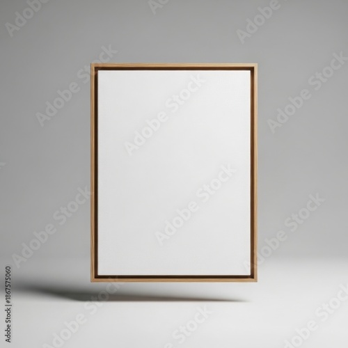 Empty floating wooden canvas frame mockup suspended against a soft grey background