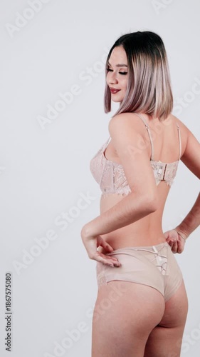 Confident woman posing in delicate lace lingerie.