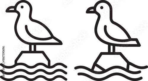 Seagulls perching on rocks in the sea