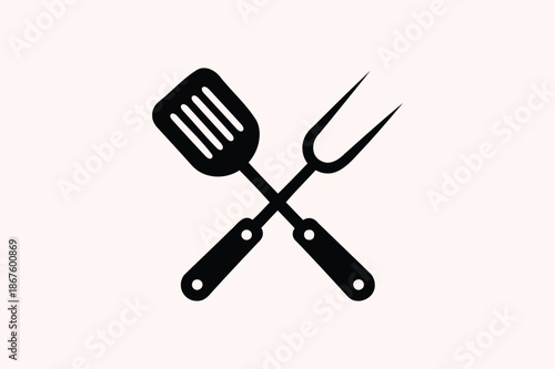Crossed Black Spatula and Fork on Light Pink Background