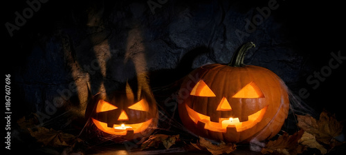 Lit  Jacko Lanterns on Autumn Leaves