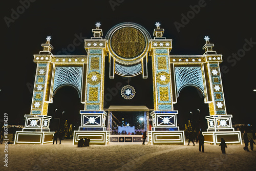 Winter Town 2026 Festival in Luzhniki. A bright light installation in the form of a large decorative arch with three openings