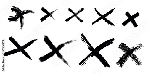 A collection of black x marks on a white background with varying brush strokes