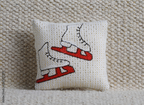 Cushion with skates on sofa
