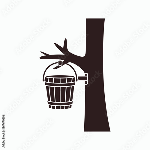 Bucket hanging from tree branch