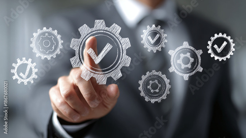 Man in suit pointing at gears with check marks. Demonstrates automation, workflow and task management for business process. Integration and system engineering concept. © Oleksandr