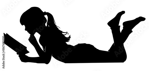 silhouette of a girl reading while lying down