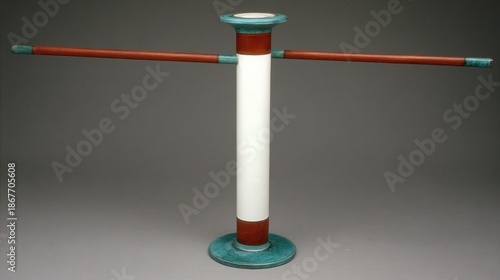 Tall freestanding rack featuring a central white column with contrasting colored accents and horizontal arms against a neutral backdrop