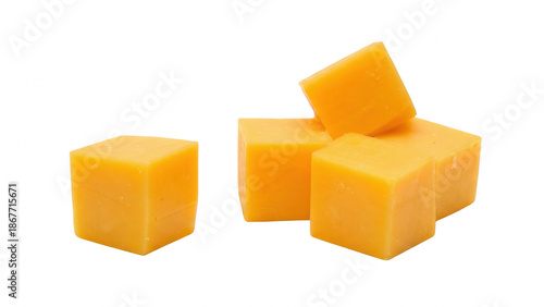Tableau sur toile Five bright orange cheddar cheese cubes for snacking or cooking preparation