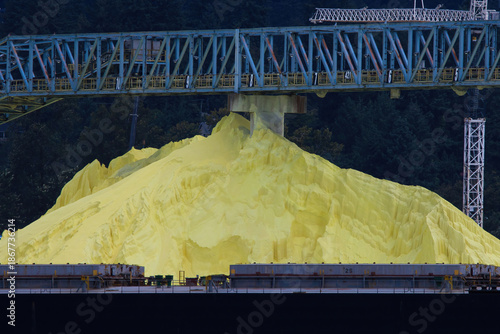 A bulk load of sulphur at a dockside ready to be loaded on a ship