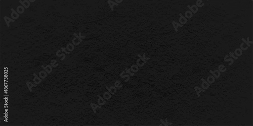 A dark, textured material backdrop featuring a blend of rough black paper, grunge leather, and blank fiber textile patterns for a macro gray surface design