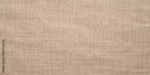 A vintage brown burlap textile material with a rough woven flax fiber pattern creates a natural old canvas backdrop and textured linen cloth design