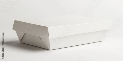 A white cardboard box with a white lid. The box is rectangular in shape. The lid is folded over the top of the box