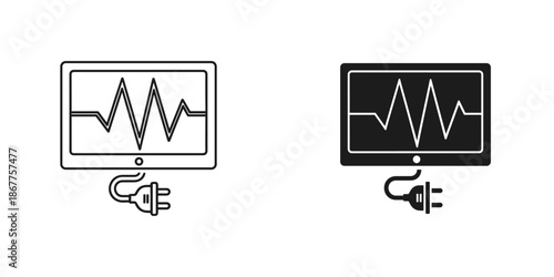 Two Monitors Displaying Heart Rate Graphs with Power Cables