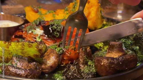 Roast Meat With Grilled Vegetables and Fresh Herbs in Serving Tray