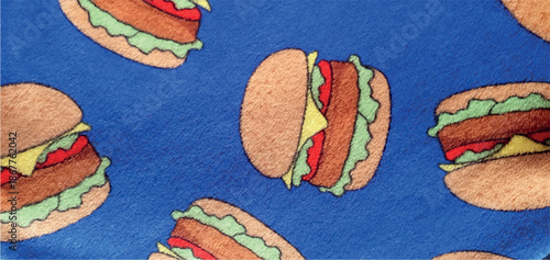 Blue fleece fabric texture with a burger print. Burger print on fabric. Cartoon burger texture background.