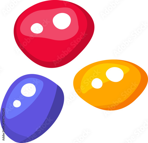 Three colorful glossy smooth and irregularly shaped candies with white reflections.