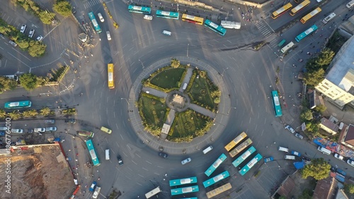 Aerial top down view of a busy roundabout with colorful buses, Addis Ababa, Ethiopia
