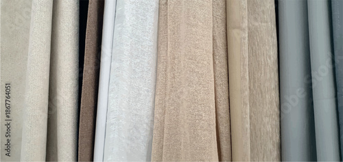 Curtains background. Curtains assortment in the home decor store. Fabric store. Interior design. Sale and purchase of curtains and drapes. Curtains assortment. Fabrics of different colors