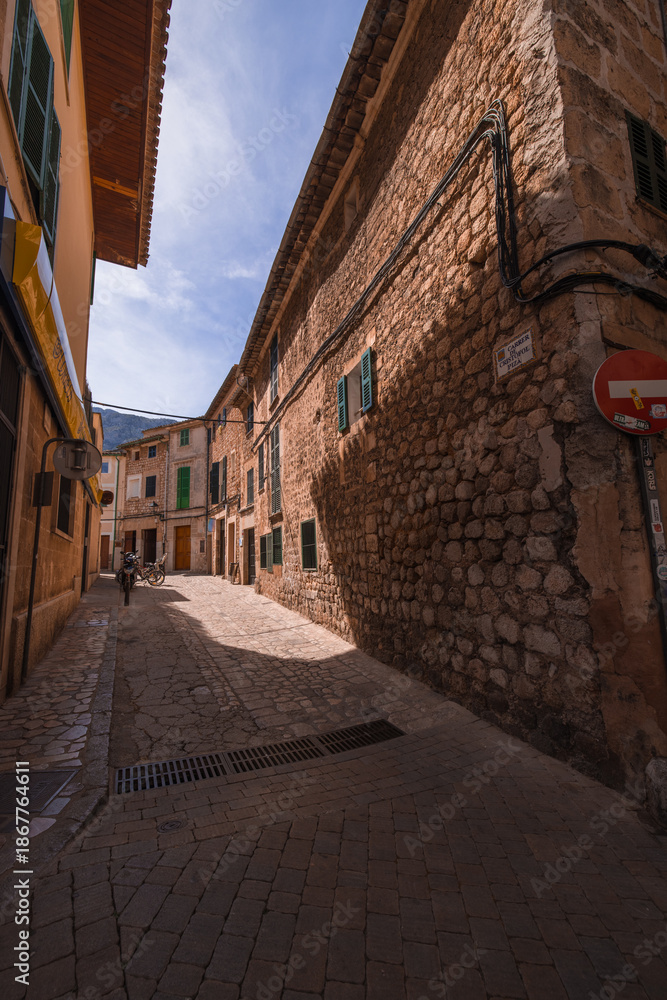 Obraz premium The streets of Soller in Majorca Spain showing old style architecture and the city life