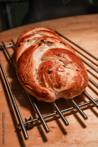 Homemade braided challah bread with raisins or raisin zopf cooling
