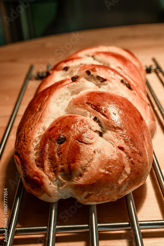 Homemade braided challah bread with raisins or raisin zopf cooling