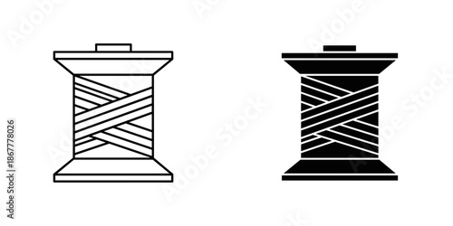 Two spools of thread with black and white lines