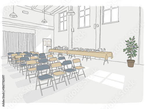 Indoor community hall with folding chairs and tables set up for rummage sale with copy space