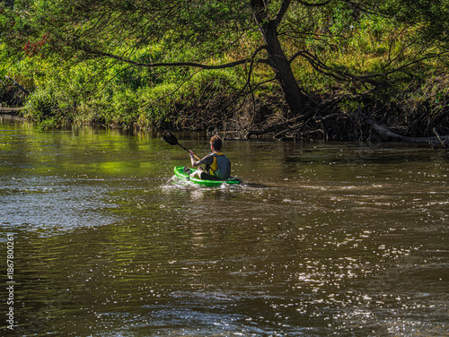 Paddling On Shaded River Down Stream