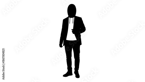 Silhouette of a man in a suit standing with one hand in pocket