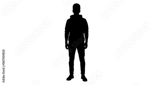 Black silhouette of a man standing against a in casual clothing