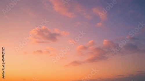 Pastel sunset sky with soft clouds
