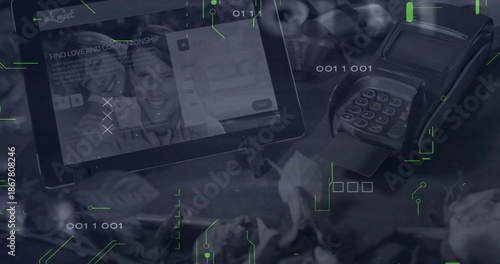 Showing tablet on stand displaying dating app at checkout among plants, card reader and binary code