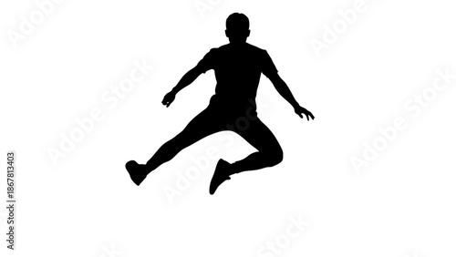 A silhouette of a person jumping in the air with arms and legs extended