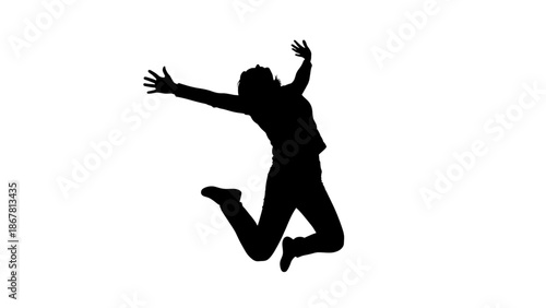 Silhouette of a person jumping in the air with arms outstretched in a joyful and carefree motion