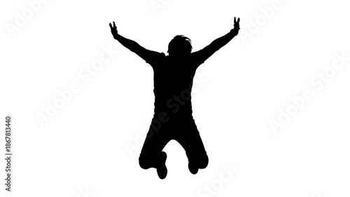 Silhouette of a person jumping up in the air with arms outstretched feeling free and happy
