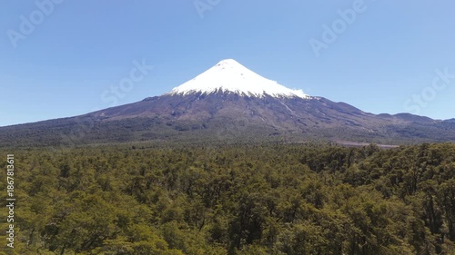 Aerial View Over Forest Treetops Heading To Osorno Volcano Peak
