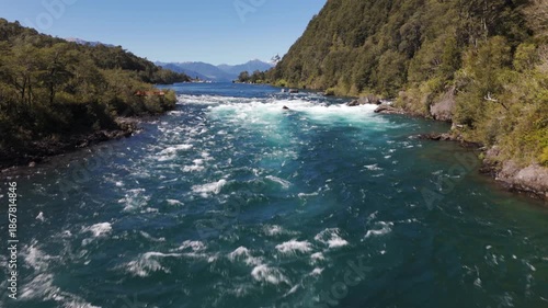 Aerial View of Emerald Glacial River with Smooth Camera Tilt to Scenic Landscape