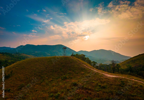 A watch tower on a beautiful sunset sky with clouds