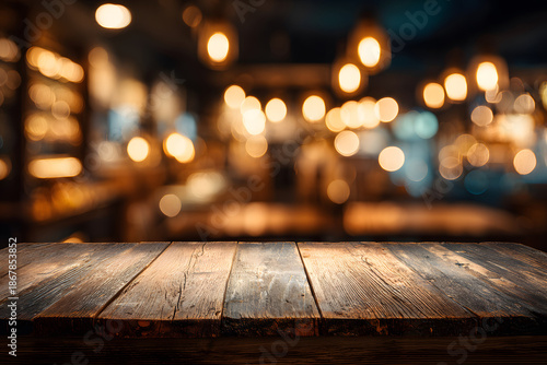 Wooden table with blurred background at a bar during evening hours with warm lights