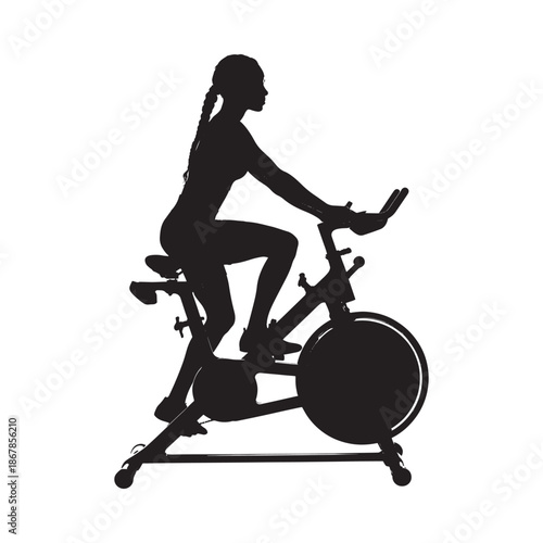 Silhouette of a woman riding an exercise bike a fitness and health concept