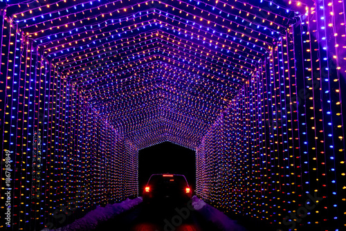 Abstract texture background view of vibrant holiday lights on a drive-through covered bridge design
