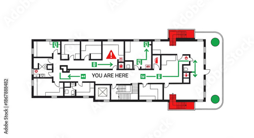 Detailed building evacuation plan with green routes  symbols including You Are Here