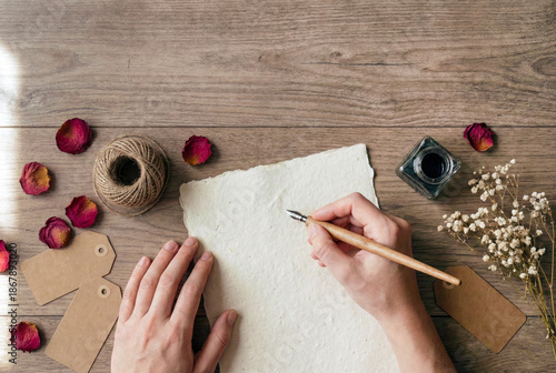 Valentine Flat Lay with Hands Writing on Blank Paper Mockup, copy space for text, commercial, marketing