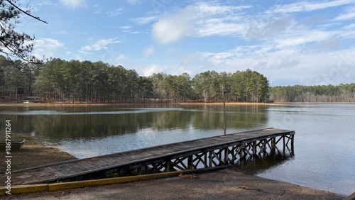 The boat ramp at Maynor Creek Water Park near the city of Waynesboro, MS. Pine forest reflects in the water.