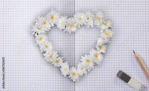 White Flowers Heart on School Notebook with Lined Pages and Pencil with Eraser. Valentines Day and Love Wallpaper Background. File with Clipping Path.