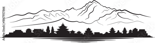 Asian city silhouette nestled below dramatic mountain range with traditional temple architecture